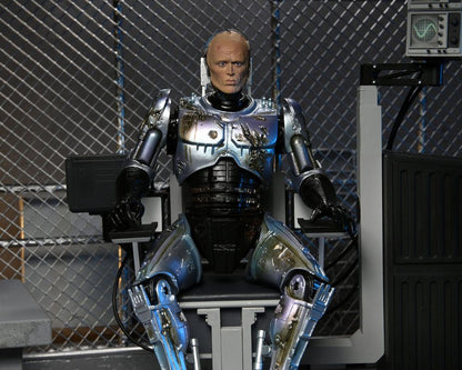 RoboCop figurine Ultimate Battle Damaged RoboCop with Chair 18 cm